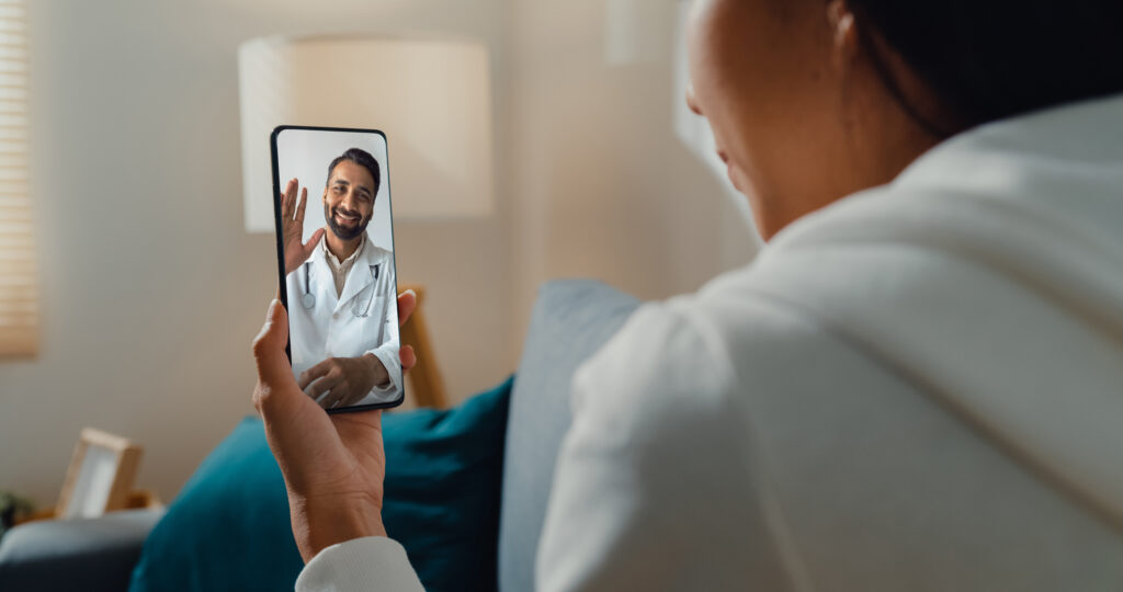 woman consulting a doctor online about diabetes via telemedicine video call on smartphone indoors