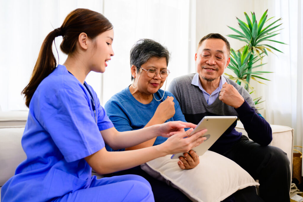 Nurse explaining glucose management to an elderly couple during a health consultation