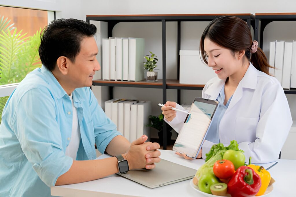 Nutritionist discussing diabetes wellness and healthy eating habits with a patient